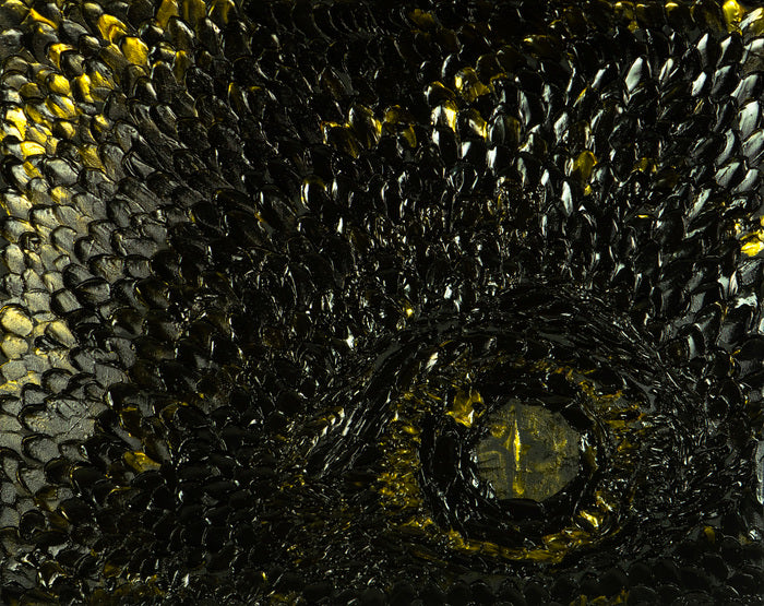 Close-up of a textured surface with black and gold patterns