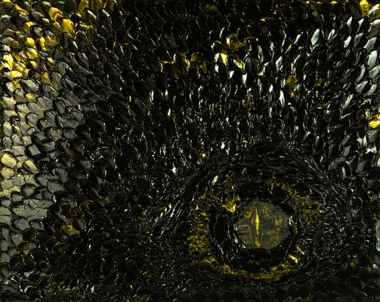 Close-up of a textured surface with black and gold patterns